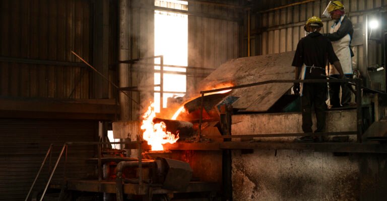 Furnace worker pouring molten copper alloy at Jaydeep Tubes